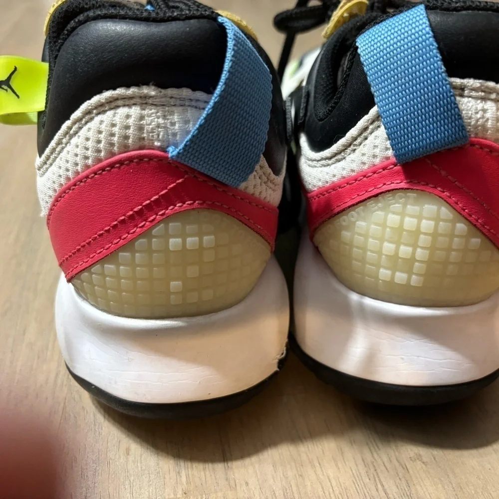 Nike Air Jordan’ size 6 Youth white, black, blue, yellow, pink.